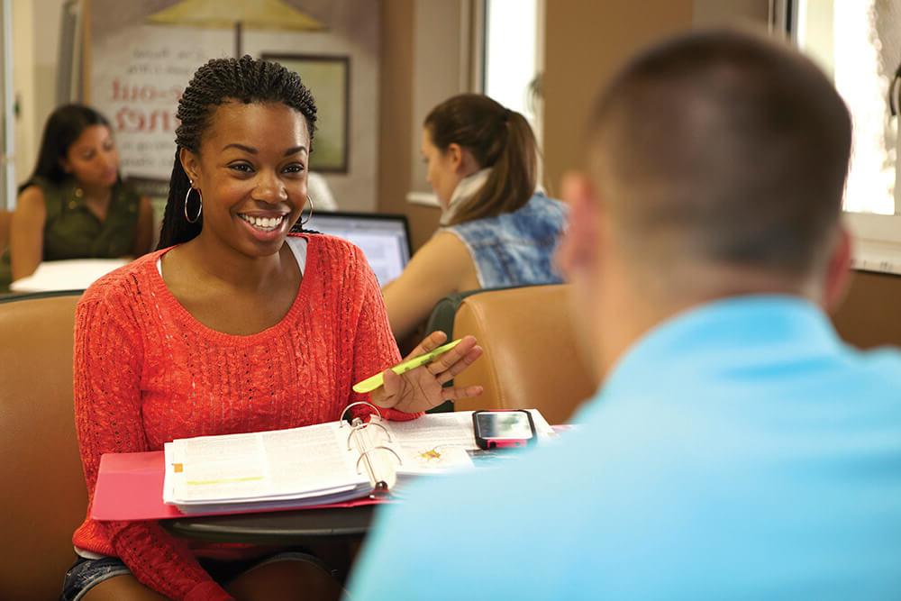 English male and female students studying